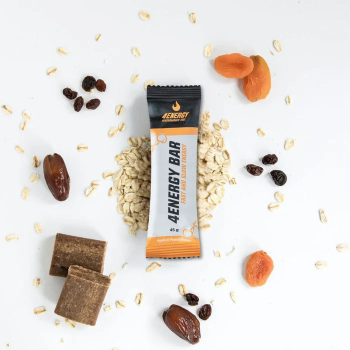 4Energy 4Energy Bar Box - 10 x 45 g sabor albaricoque y melocotón, envase apto para veganos con ilustraciones de albaricoque y melocotón y código QR.